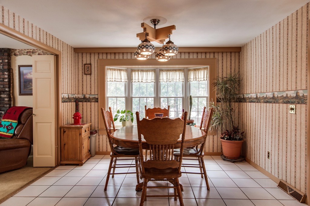 153 Leslie Road Rowley, MA 01969 - Photo 4 of 21 a view of a dining room with furniture and chandelier