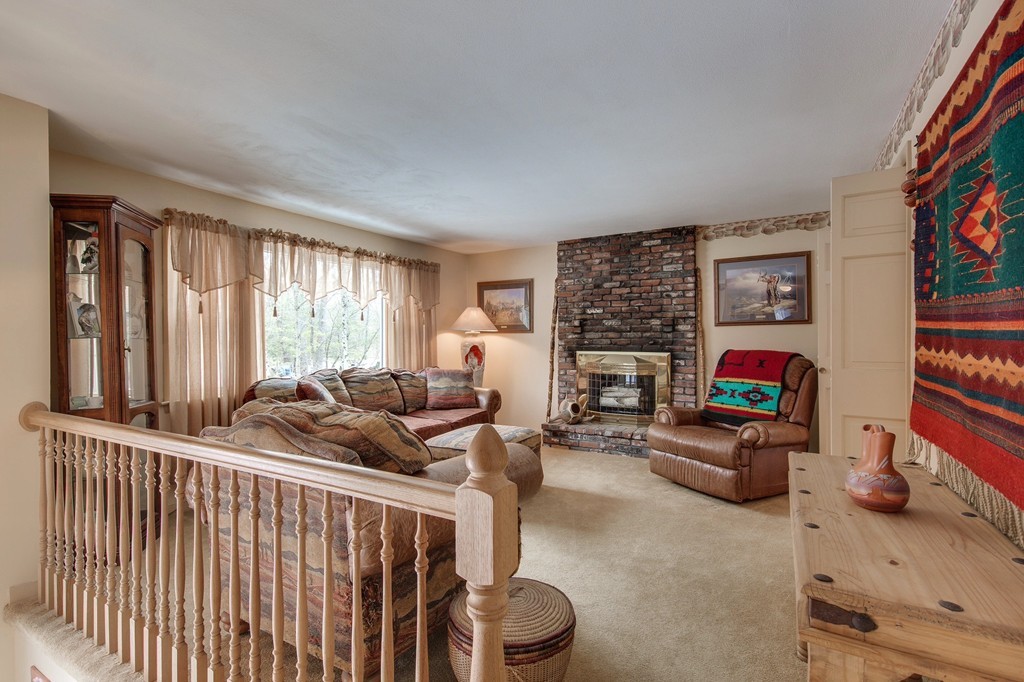 153 Leslie Road Rowley, MA 01969 - Photo 6 of 21 a living room with furniture and a flat screen tv