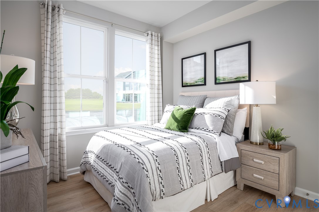 4719 Cloverleigh Drive Midlothian, VA 23112 - Photo 22 of 24 a bedroom with a bed lamp and windows