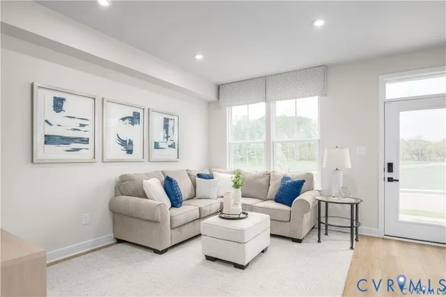 a living room with furniture and a large window