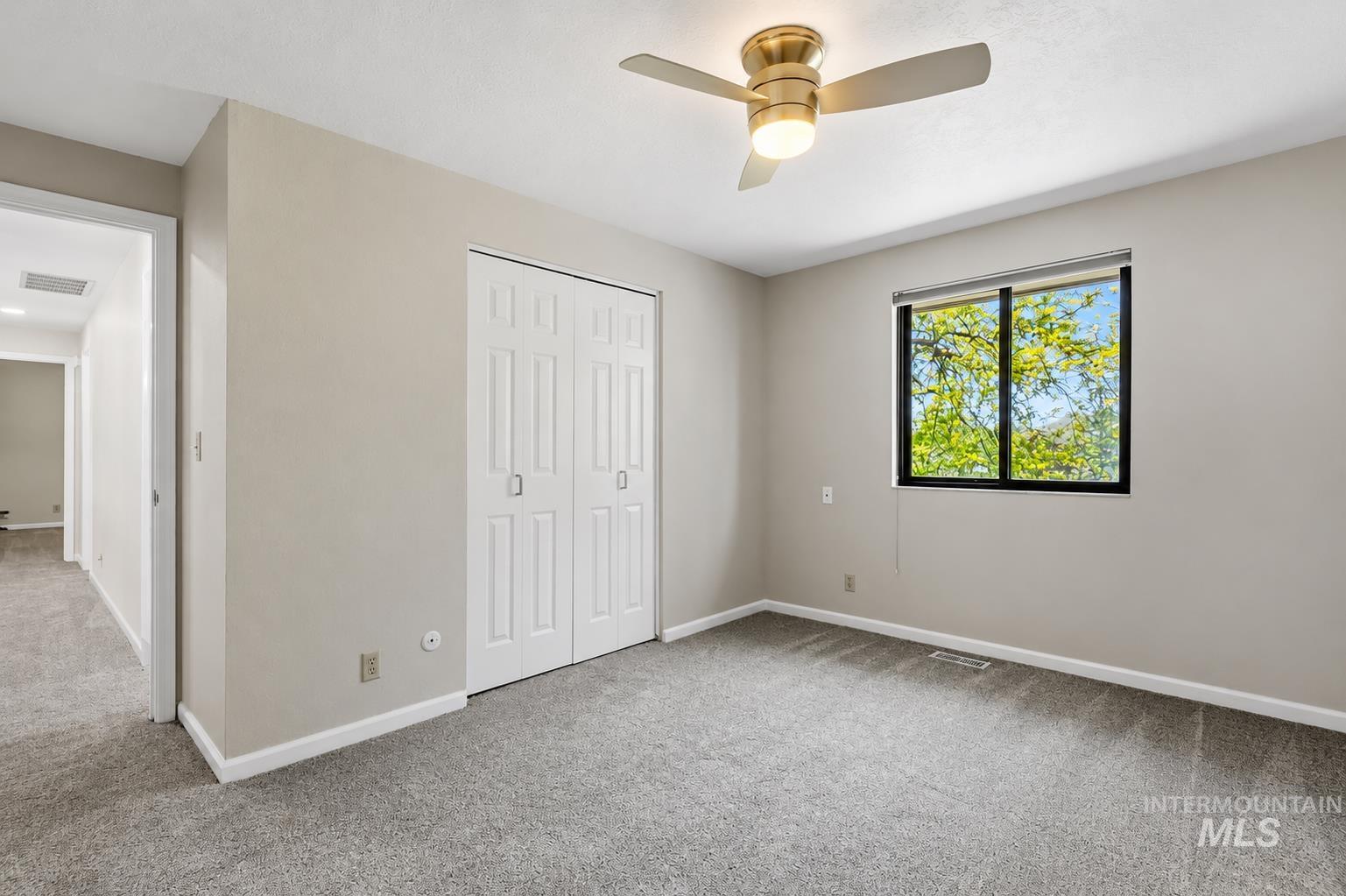 599 Pebble Beach Way Eagle, ID 83616 - Photo 32 of 44 Bedroom featuring neutral painted walls and gray carpeting
