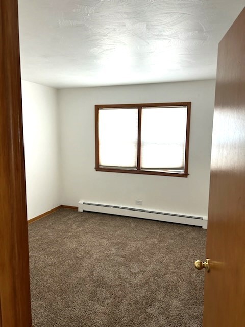 21-w139 Tee Lane Lane, Unit 2 Itasca, IL 60143 - Photo 6 of 9 an empty room with a window