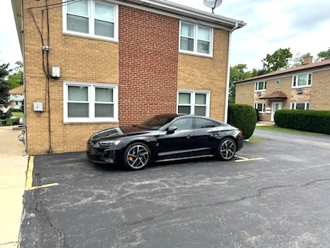 21-w139 Tee Lane Lane, Unit 2 Itasca, IL 60143 - Photo 9 of 9 a car parked in front of a brick house