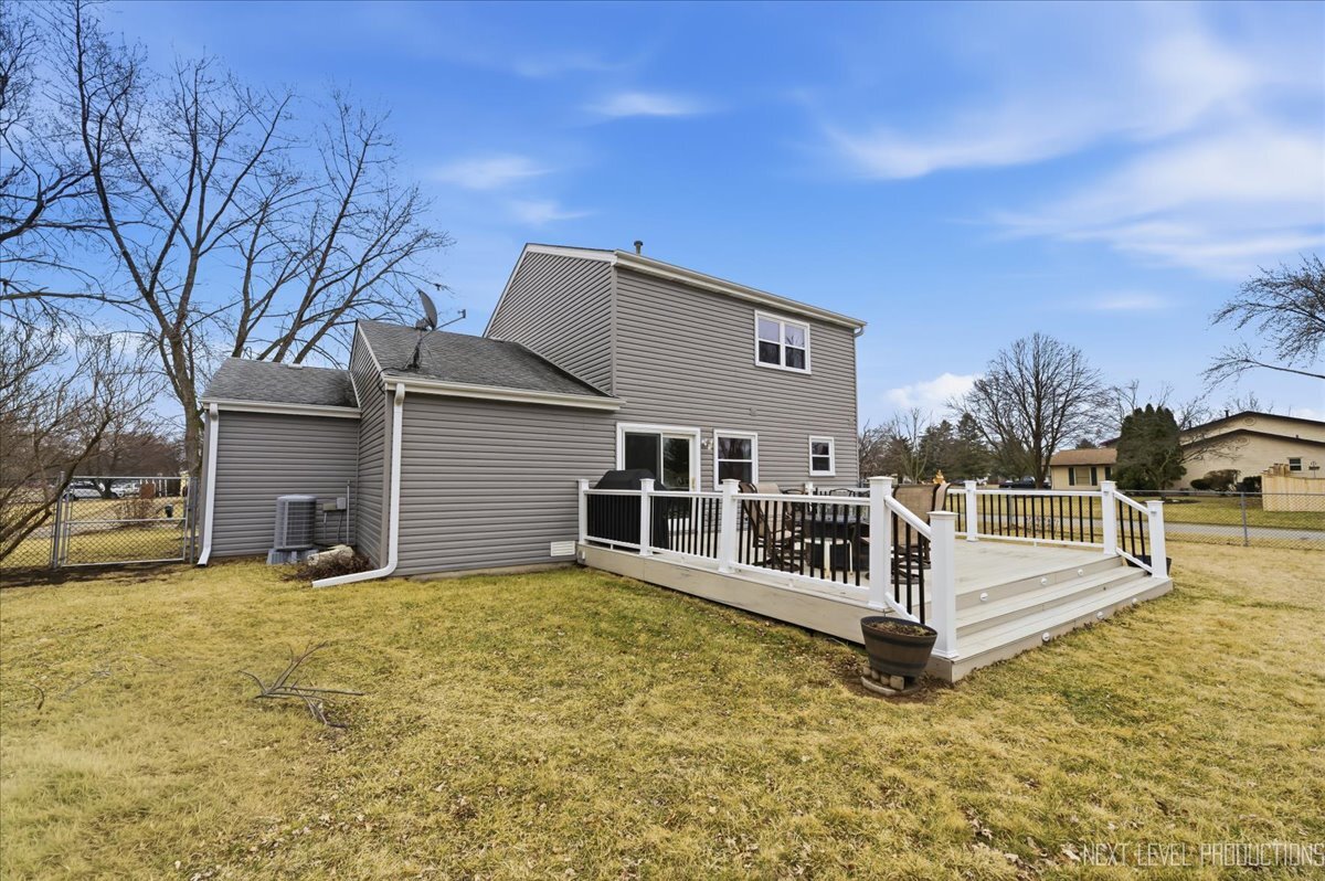 104 Augusta Road Oswego, IL 60543 - Photo 20 of 24 a view of a house with a yard