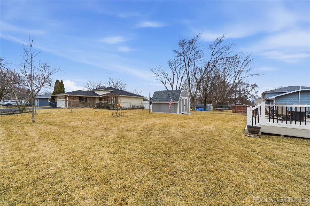 104 Augusta Road Oswego, IL 60543 - Photo 21 of 24 a view of residential houses with yard and trees