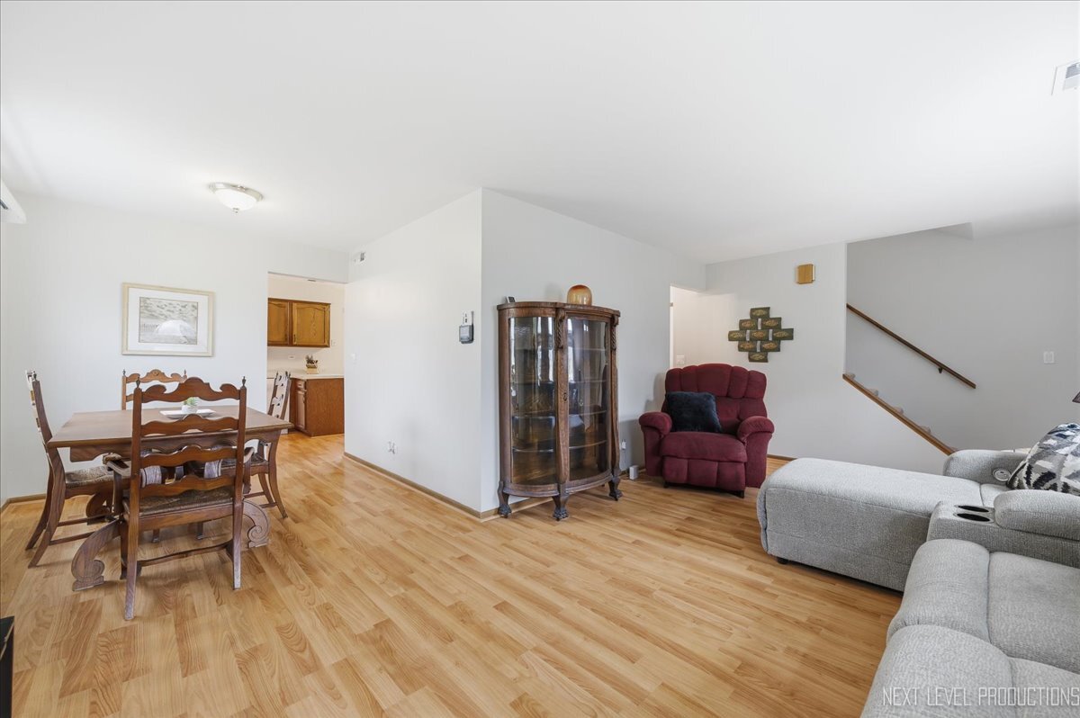 104 Augusta Road Oswego, IL 60543 - Photo 4 of 24 a living room with furniture and a wooden floor