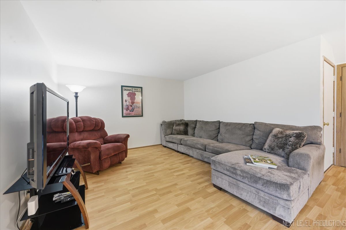 104 Augusta Road Oswego, IL 60543 - Photo 9 of 24 a living room with furniture and a couch
