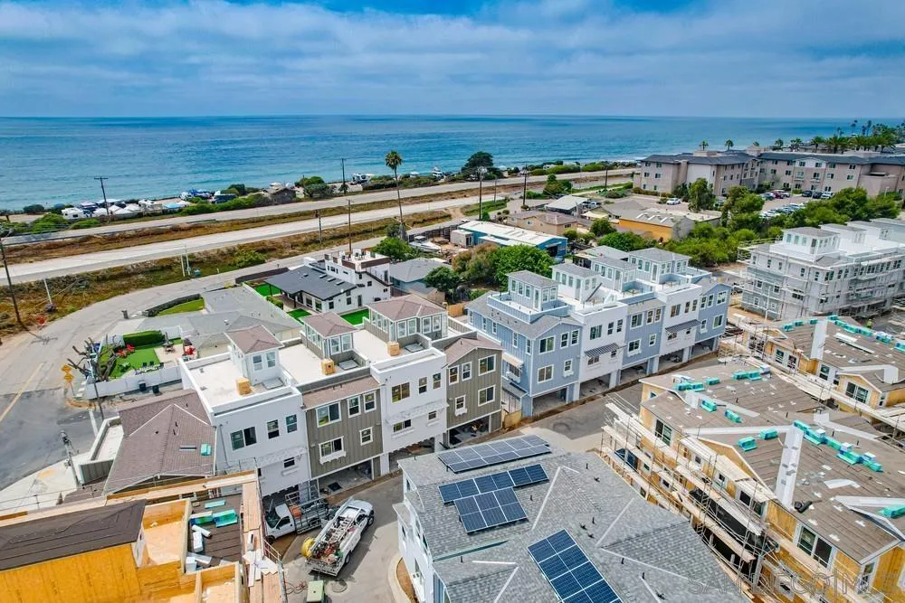 7479 Ponto Road Carlsbad, CA 92011 - Photo 7 of 26 an aerial view of a city with lots of residential buildings and ocean view in back