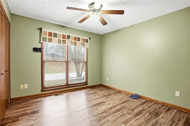 a bathroom with a sink a mirror and a shower