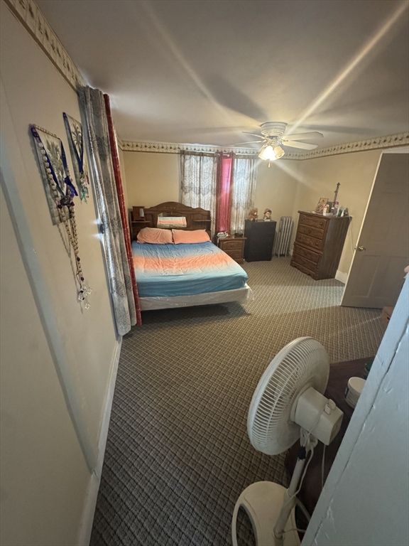 158 Bowles Street Springfield, MA 01109 - Photo 11 of 17 a bedroom with furniture and a window