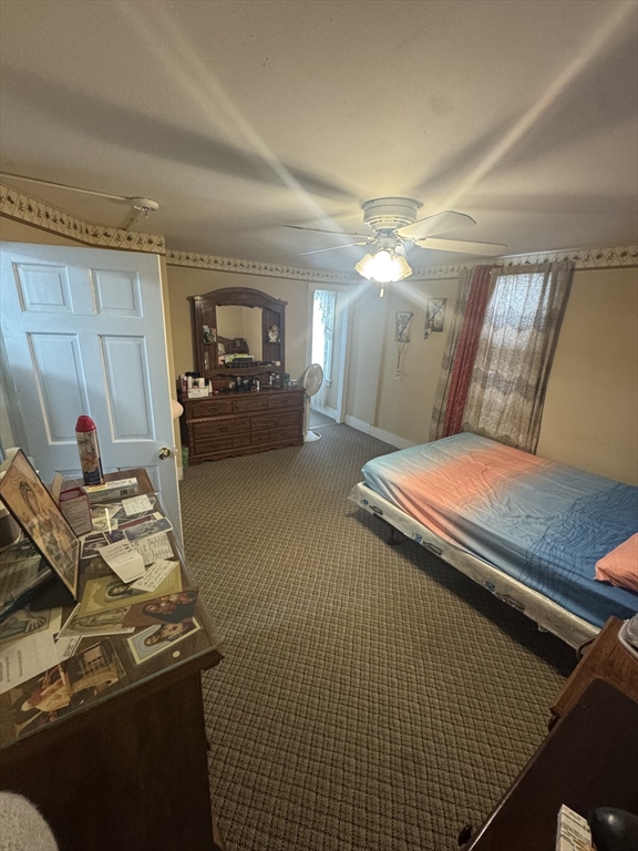 158 Bowles Street Springfield, MA 01109 - Photo 12 of 17 a bedroom with a bed and a mirror