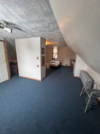 a view of a livingroom with furniture and a ceiling fan