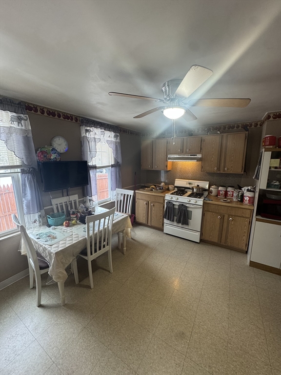 158 Bowles Street Springfield, MA 01109 - Photo 4 of 17 a view of a dining room with furniture and chandelier