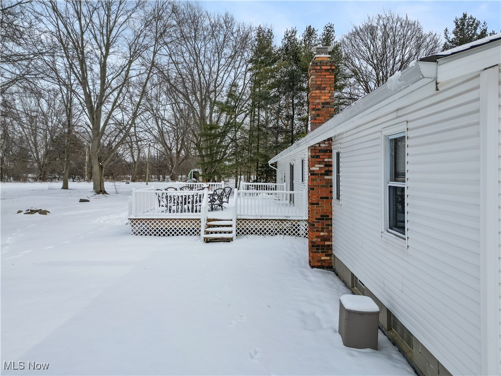 6059 Branch Road Medina, OH 44256 - Photo 31 of 39 Yard covered in snow featuring a deck