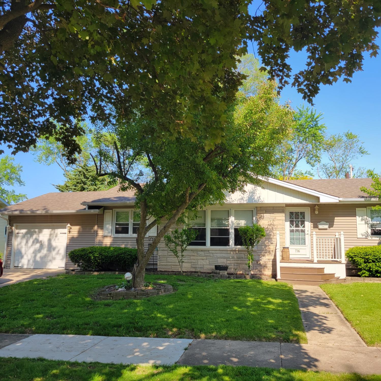 716 South Sherman Street Crown Point, IN 46307 - Photo 3 of 25 a front view of a house with a garden
