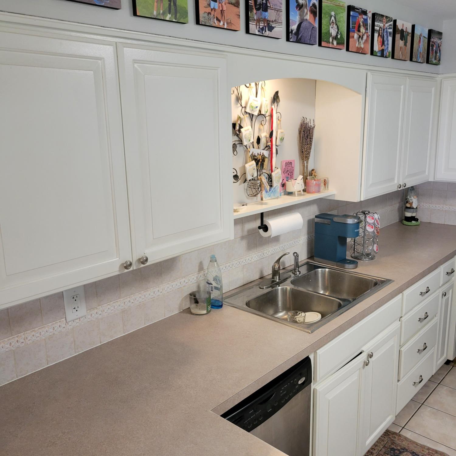 716 South Sherman Street Crown Point, IN 46307 - Photo 6 of 25 a kitchen with cabinets and window