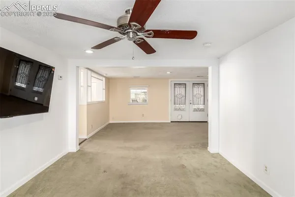 a view of an empty room with a window