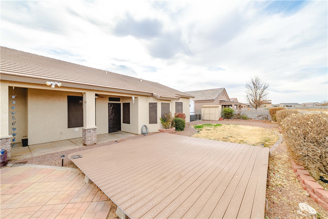 4915 North Neal Ranch Road Kingman, AZ 86401 - Photo 54 of 61 a view of a house with wooden floor and a yard
