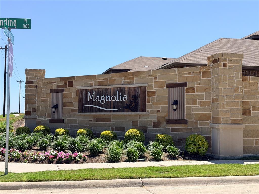 816 Country Road Royse City, TX 75189 - Photo 17 of 25 Stone monument sign featuring a central "Magnolia" wood-finish panel