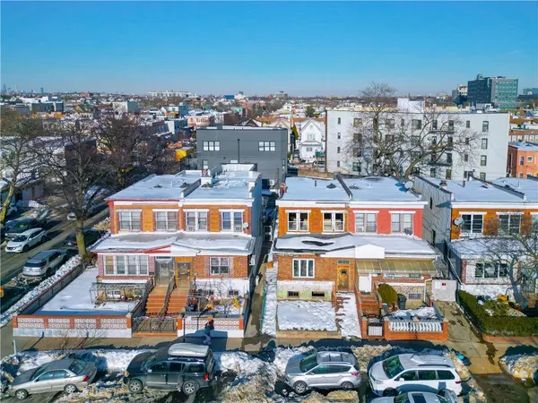 an aerial view of houses with outdoor space