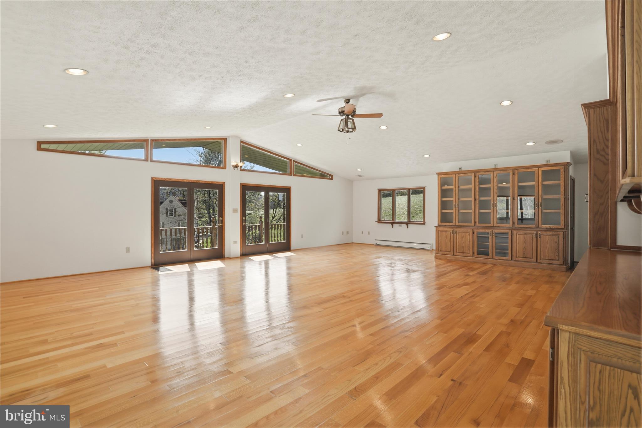 12623 Windy Ridge Drive Mount Savage, MD 21545 - Photo 35 of 72 a view of an empty room with wooden floor and a window