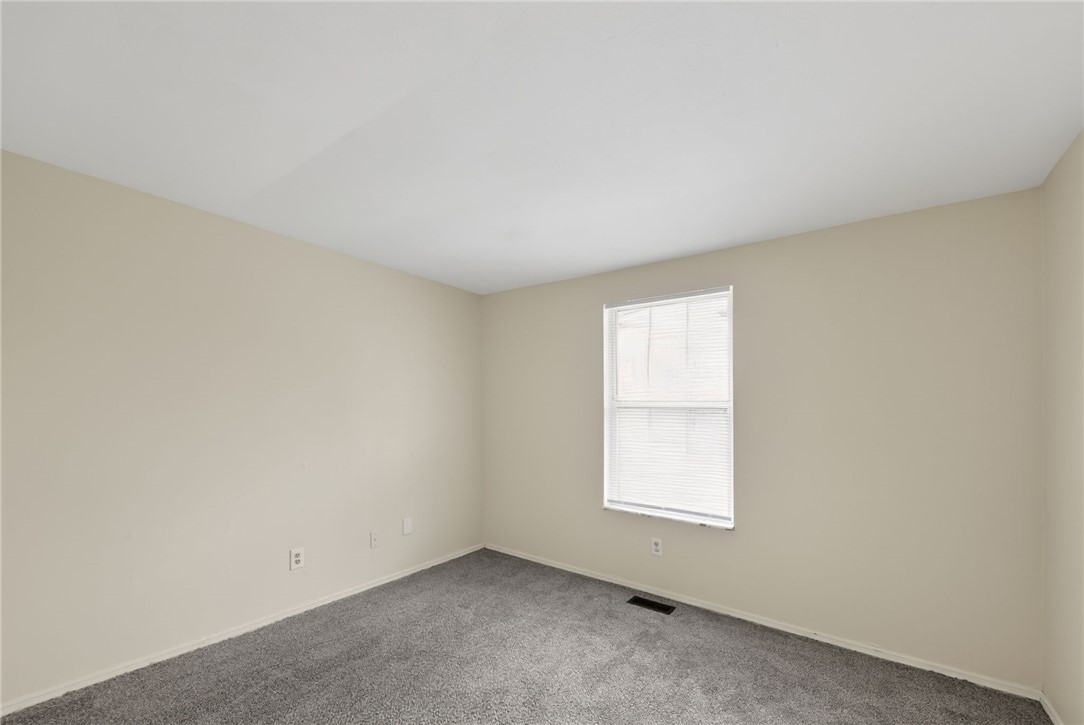 6070 Charlesgate Road Huber Heights, OH 45424 - Photo 16 of 29 This cozy bedroom features plush carpet flooring and a sun-filled window, creating a serene personal retreat.