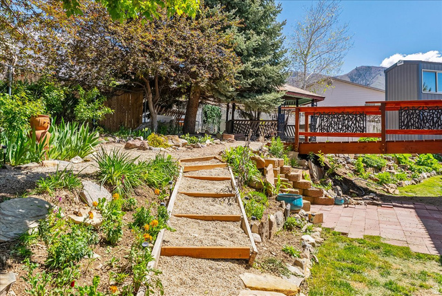 11 South Clark Lane Elk Ridge, UT 84651 - Photo 41 of 46 View of yard featuring stairs and a deck with mountain view