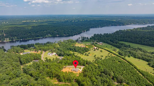 a view of a lake with a yard