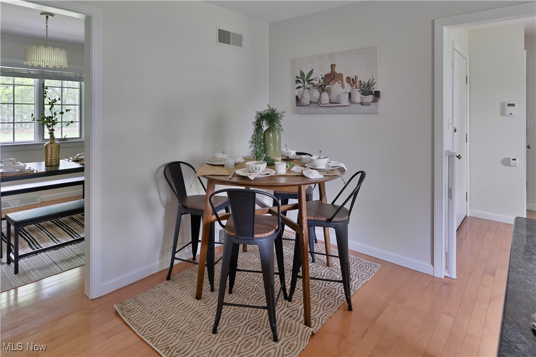 7091 South Raccoon Road Canfield, OH 44406 - Photo 11 of 39 Dining space with light wood-type flooring and baseboards