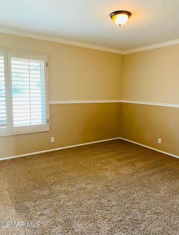 an empty room with a empty space and a window