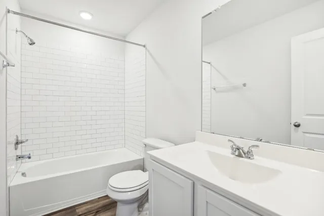 a bathroom with a sink a toilet and a bathtub
