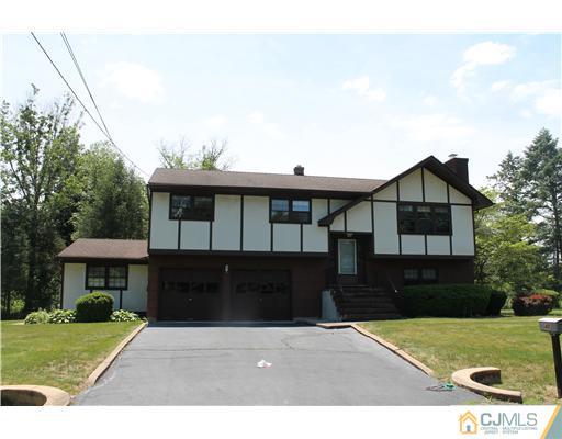 48 Smith Road Somerset, NJ 08873 - Photo 1 of 23 a front view of a house with a garden