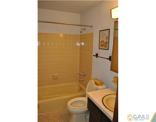48 Smith Road Somerset, NJ 08873 - Photo 11 of 23 a bathroom with a toilet and a shower