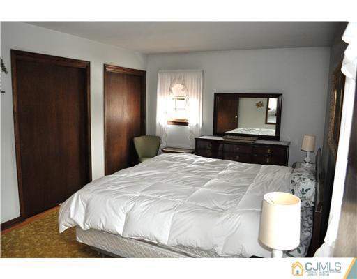 48 Smith Road Somerset, NJ 08873 - Photo 13 of 23 a bedroom with a bed and a television