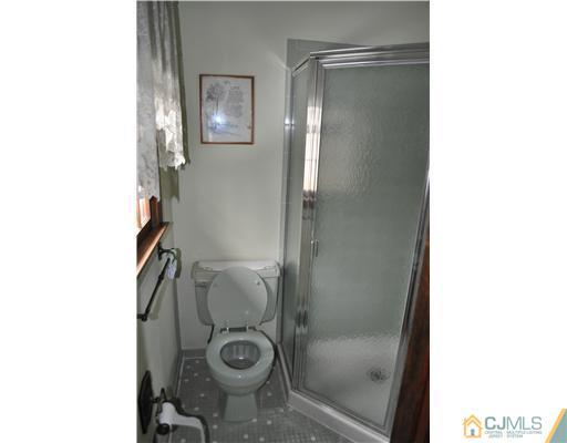 48 Smith Road Somerset, NJ 08873 - Photo 14 of 23 a bathroom with a granite countertop shower and a sink