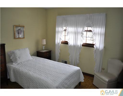 48 Smith Road Somerset, NJ 08873 - Photo 16 of 23 a bedroom with a bed and glass windows