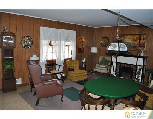 48 Smith Road Somerset, NJ 08873 - Photo 18 of 23 a living room with furniture a table and white walls