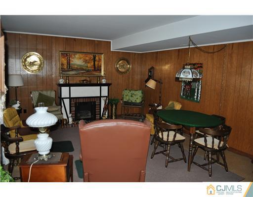 48 Smith Road Somerset, NJ 08873 - Photo 19 of 23 a living room with furniture and a fireplace