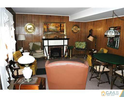 48 Smith Road Somerset, NJ 08873 - Photo 20 of 23 a dining room with furniture and chandelier