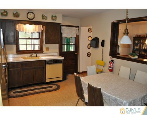 48 Smith Road Somerset, NJ 08873 - Photo 3 of 23 a kitchen with stainless steel appliances granite countertop a stove and a sink