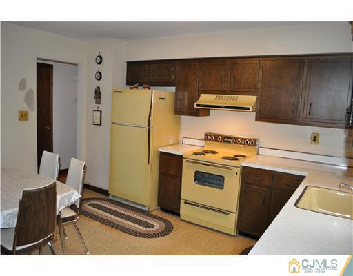 48 Smith Road Somerset, NJ 08873 - Photo 4 of 23 a kitchen with a stove and a refrigerator
