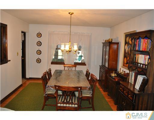 48 Smith Road Somerset, NJ 08873 - Photo 6 of 23 a dining room with furniture and wooden floor