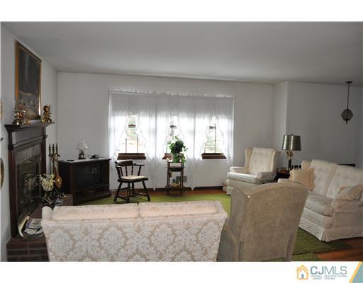 48 Smith Road Somerset, NJ 08873 - Photo 8 of 23 a living room with furniture and a flat screen tv