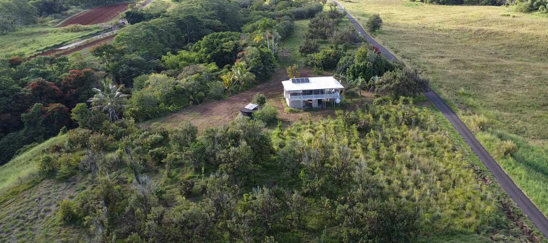 2525 Lot 62 Maikalani Street Hilo, HI 96720 - Photo 3 of 11 a view of a house with a yard