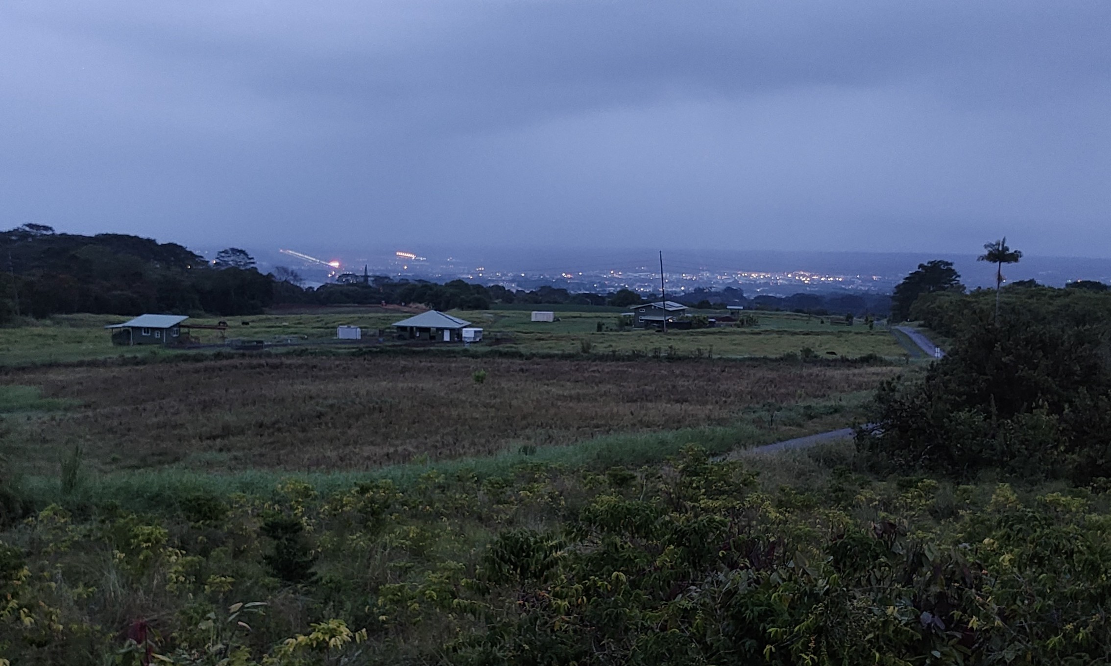 2525 Lot 62 Maikalani Street Hilo, HI 96720 - Photo 5 of 11 a view of a town with mountains in the background