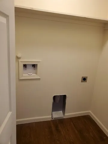 a view of a small space with wooden floor