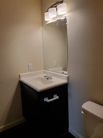 a bathroom with a sink and a toilet