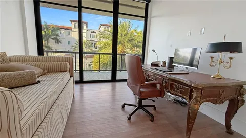 a bedroom with furniture and a window