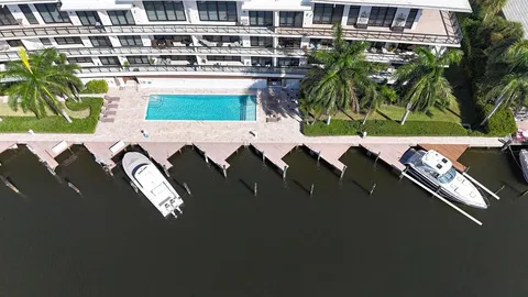 an aerial view of a house with garden space and street view