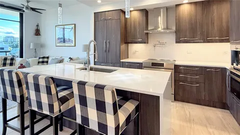 a kitchen with a stove a sink and a refrigerator